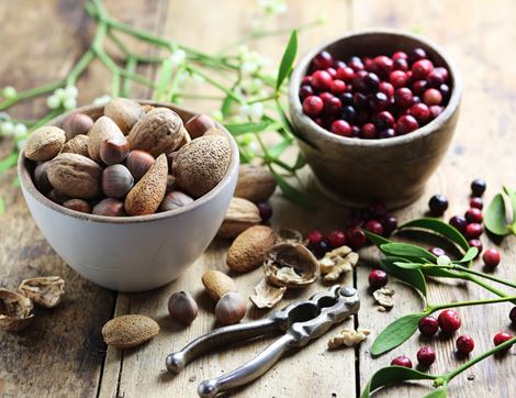 organic nuts and cranberries in bowls